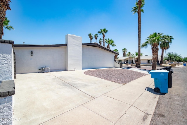 3646 W Brown St, Phoenix, AZ 85051 - view of side of home with stucco siding and a patio