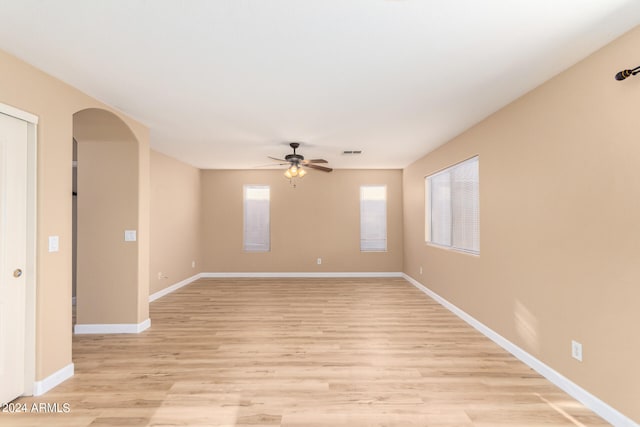 spare room featuring ceiling fan and light wood-type flooring