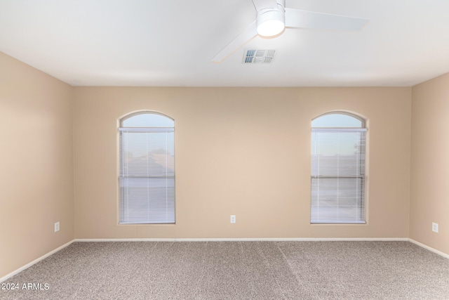 unfurnished room with carpet and ceiling fan