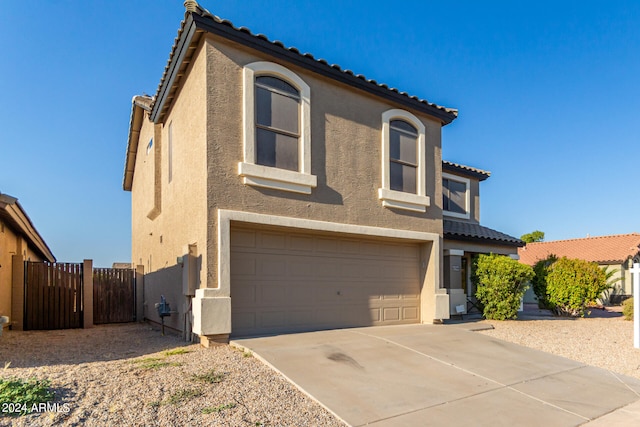 view of front of property with a garage