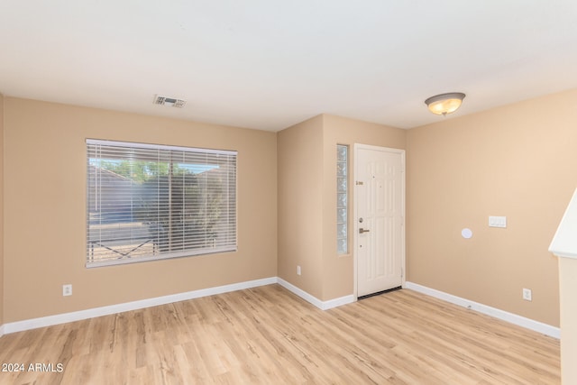 foyer entrance with light hardwood / wood-style floors