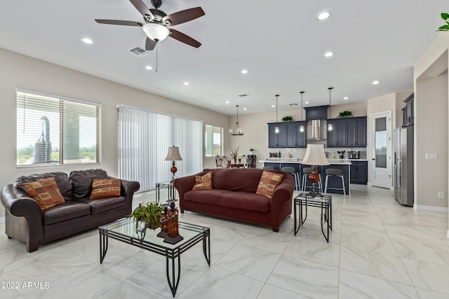 living room with ceiling fan and light tile floors