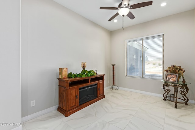 living area featuring ceiling fan and tile floors