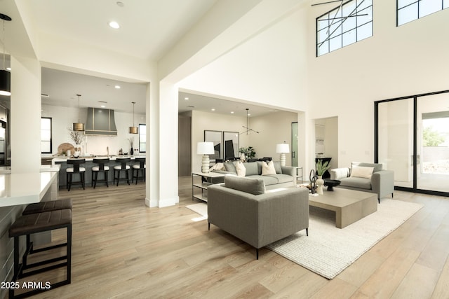 2315 E Mine Creek Rd, Phoenix, AZ 85024 - living area featuring light wood-style flooring, recessed lighting, and a towering ceiling
