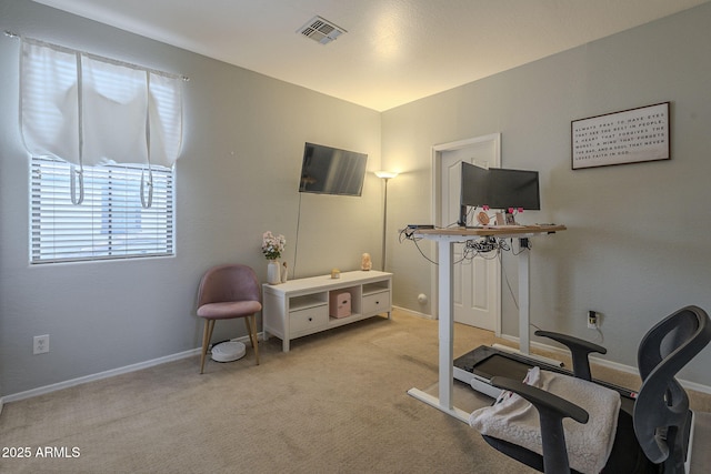 workout room with light colored carpet, visible vents, and baseboards