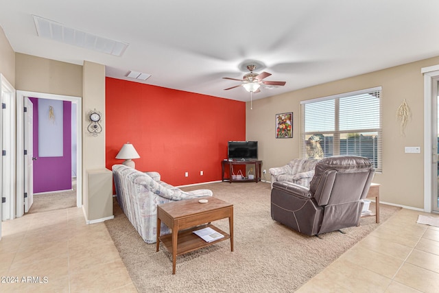 carpeted living room featuring ceiling fan