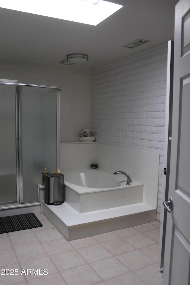 bathroom featuring a garden tub, visible vents, tile patterned flooring, and a stall shower
