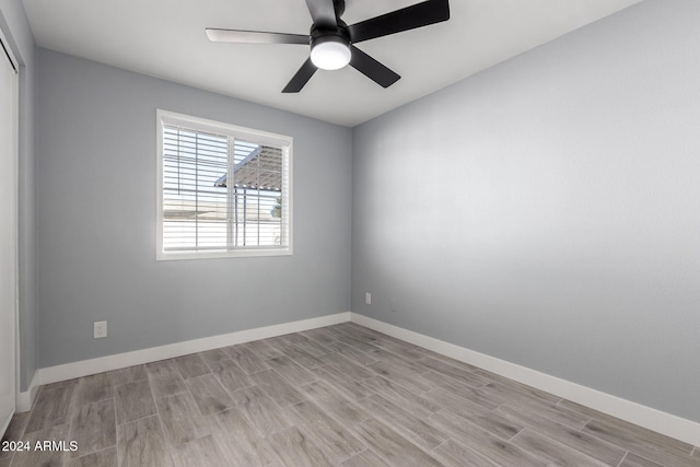 unfurnished room with ceiling fan and light hardwood / wood-style flooring