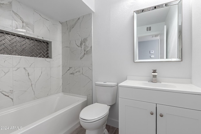 full bathroom featuring wood-type flooring, vanity, toilet, and tiled shower / bath