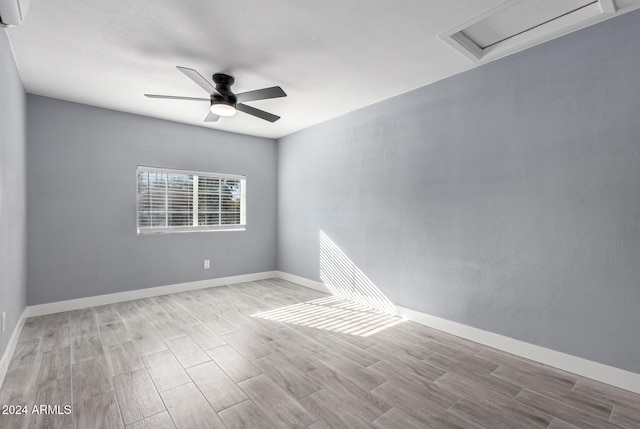 spare room with ceiling fan and light hardwood / wood-style floors