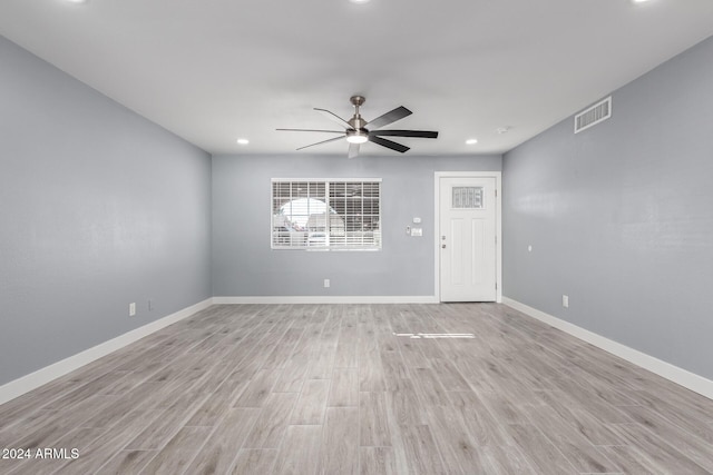 spare room featuring ceiling fan and light wood-type flooring