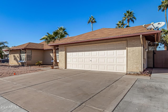 single story home featuring a garage