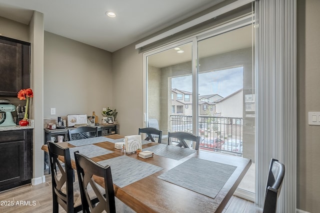 dining room with light hardwood / wood-style flooring