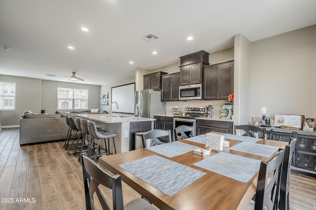 dining space featuring ceiling fan