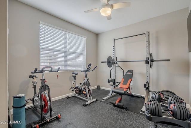 workout room featuring ceiling fan and plenty of natural light