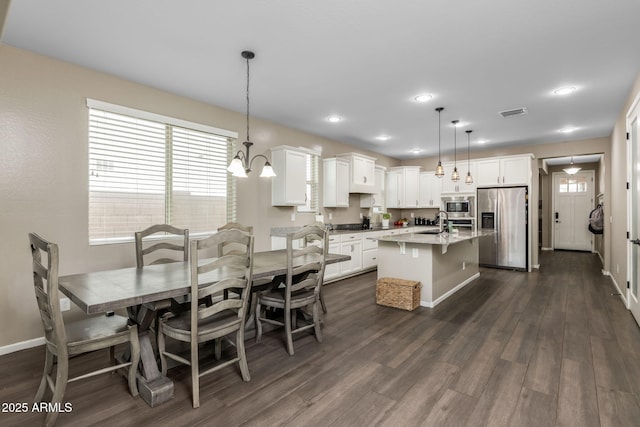 dining room with recessed lighting, visible vents, baseboards, and dark wood-type flooring