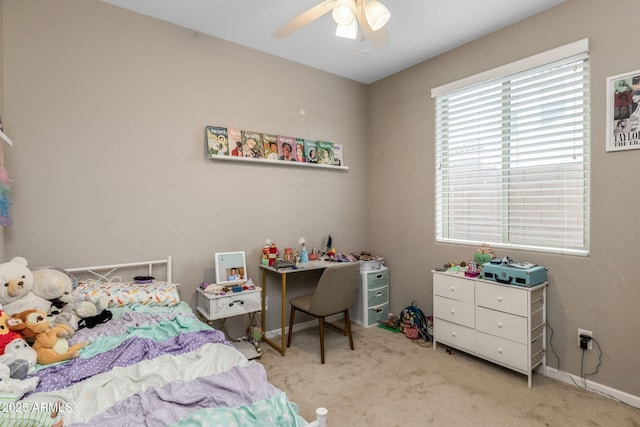 bedroom featuring baseboards, carpet floors, and a ceiling fan