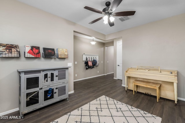 interior space with visible vents, baseboards, and wood finished floors