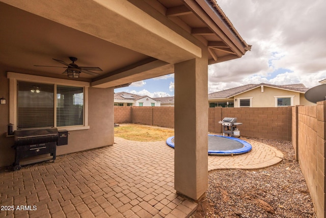 view of patio / terrace with a fenced backyard and ceiling fan