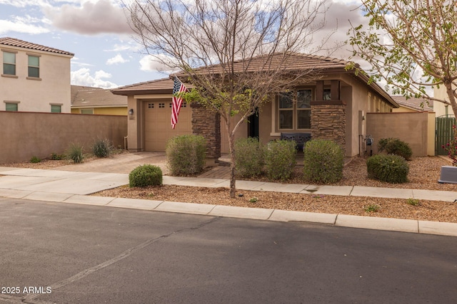 view of front of house with fence, an attached garage, stucco siding, concrete driveway, and stone siding