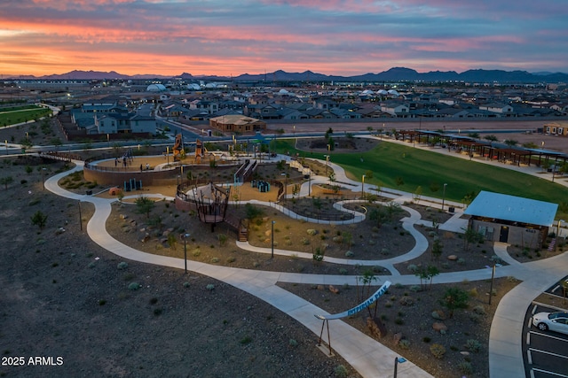 birds eye view of property featuring a mountain view and a residential view