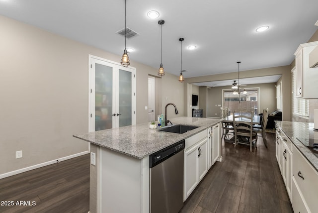 kitchen with visible vents, a sink, dishwasher, white cabinetry, and dark wood-style flooring