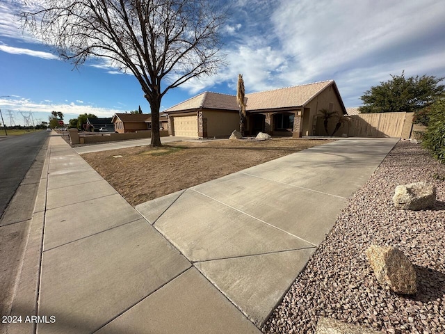 ranch-style home featuring a garage