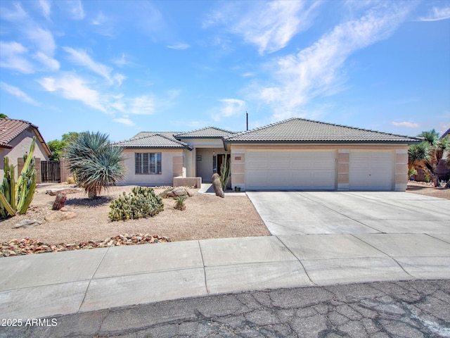 10501 W Wilshire Dr, Avondale, AZ 85392 - single story home featuring a garage, concrete driveway, a tile roof, and stucco siding