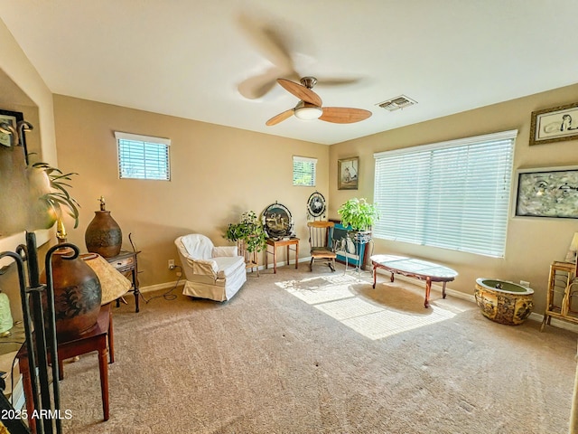 4939 W Harwell Rd, Laveen, AZ 85339 - living area featuring ceiling fan, carpet flooring, visible vents, and baseboards