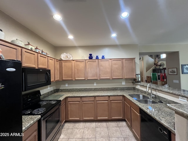 4939 W Harwell Rd, Laveen, AZ 85339 - kitchen with light tile patterned floors, recessed lighting, a sink, light stone countertops, and black appliances