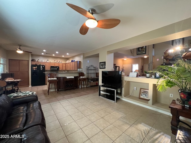 4939 W Harwell Rd, Laveen, AZ 85339 - living room featuring ceiling fan, recessed lighting, light tile patterned flooring, and a healthy amount of sunlight