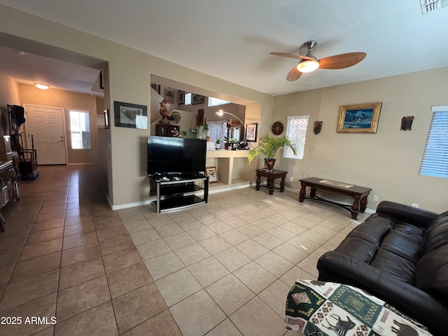 4939 W Harwell Rd, Laveen, AZ 85339 - tiled living area with visible vents, ceiling fan, and baseboards
