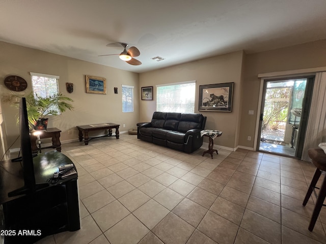 4939 W Harwell Rd, Laveen, AZ 85339 - living room featuring light tile patterned floors, baseboards, visible vents, and a ceiling fan