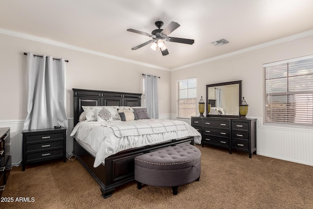 carpeted bedroom featuring visible vents, crown molding, and ceiling fan