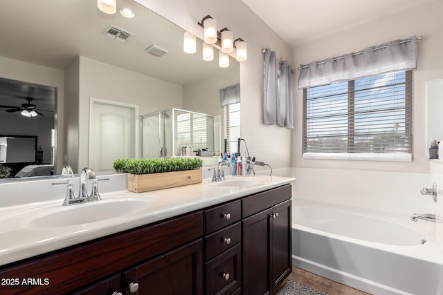 full bath with a bath, ensuite bath, visible vents, and a sink