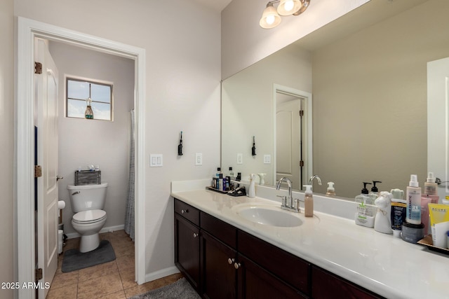 full bath featuring toilet, baseboards, vanity, and tile patterned floors