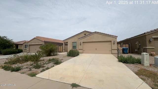 13142 E Aster Ln, Florence, AZ 85132 - view of front facade featuring a tile roof, stucco siding, driveway, and a garage