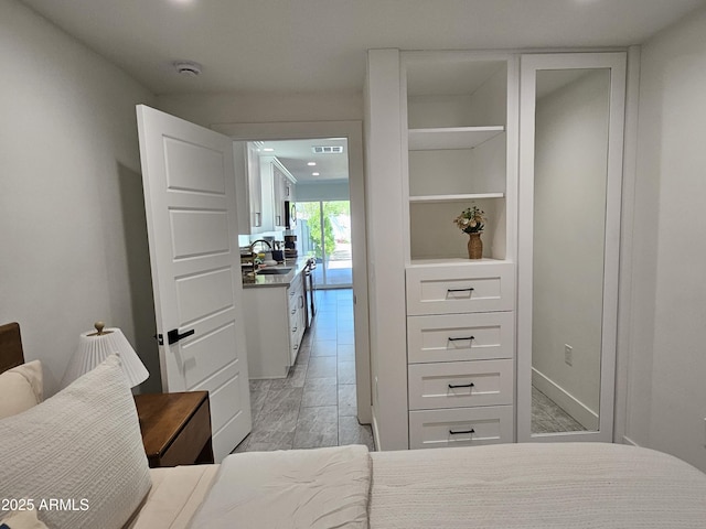 bedroom with a sink, baseboards, recessed lighting, and visible vents