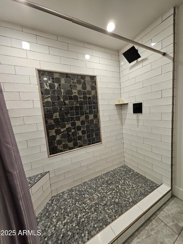 bathroom with recessed lighting and tiled shower