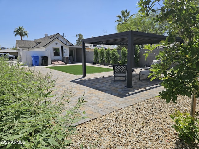 view of patio with a gazebo, fence, and cooling unit