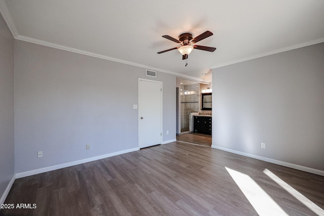 unfurnished living room featuring hardwood / wood-style flooring, crown molding, and ceiling fan