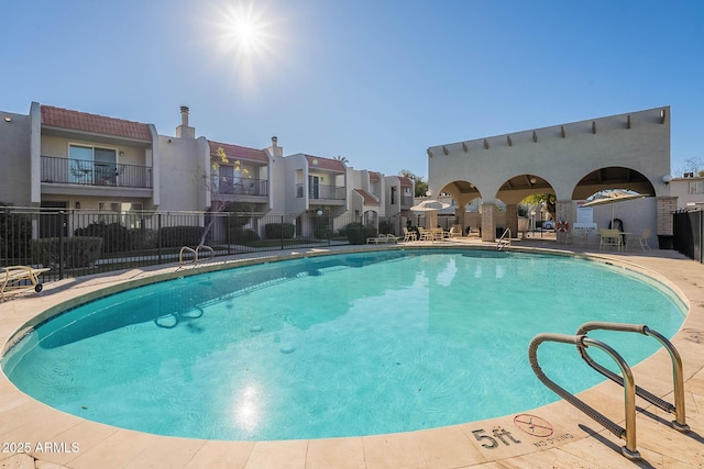 view of swimming pool featuring a patio area