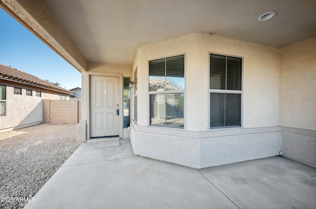 doorway to property with a patio area