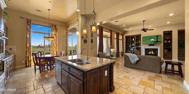 36813 N 109th Way, Scottsdale, AZ 85262 - kitchen featuring ceiling fan, recessed lighting, stone tile flooring, dark brown cabinetry, and dishwasher