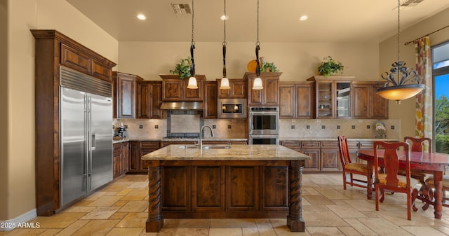 36813 N 109th Way, Scottsdale, AZ 85262 - kitchen with built in appliances, stone tile flooring, plenty of natural light, tasteful backsplash, and recessed lighting