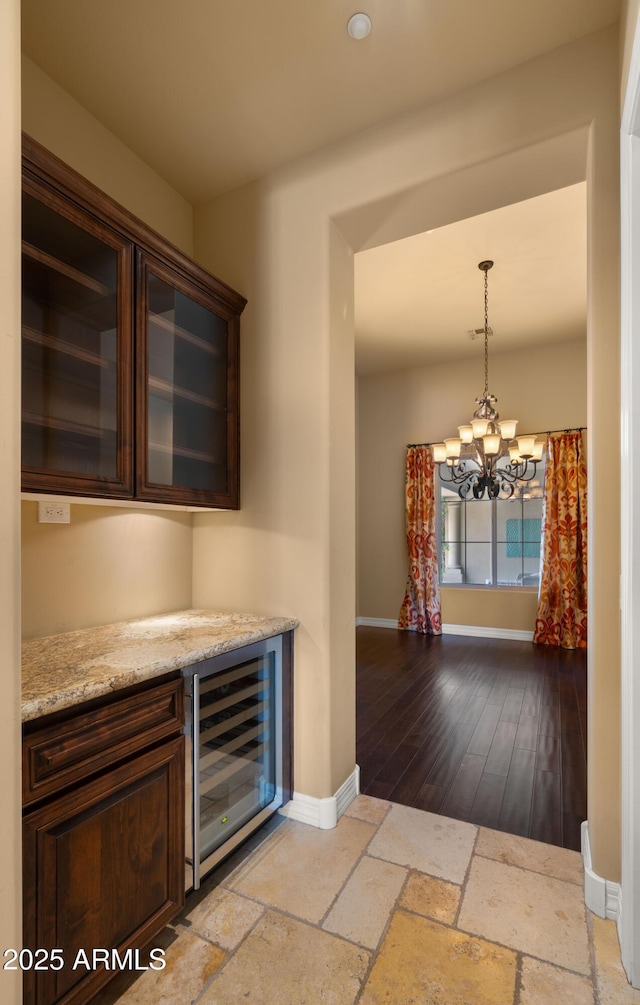 36813 N 109th Way, Scottsdale, AZ 85262 - indoor dry bar with beverage cooler, a chandelier, and pendant lighting