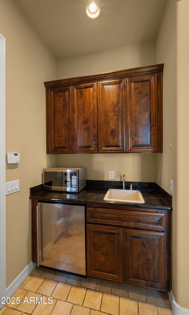 36813 N 109th Way, Scottsdale, AZ 85262 - kitchen featuring stainless steel microwave, refrigerator, dark countertops, and dark brown cabinets