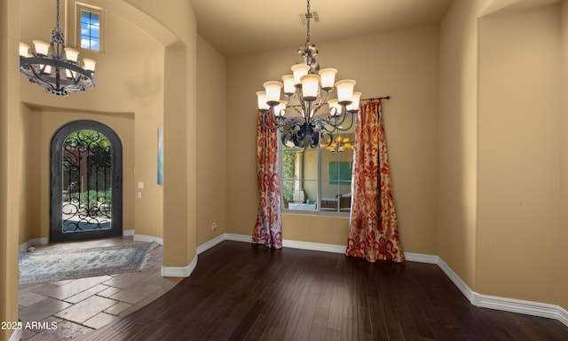 36813 N 109th Way, Scottsdale, AZ 85262 - foyer featuring a chandelier, arched walkways, and healthy amount of natural light