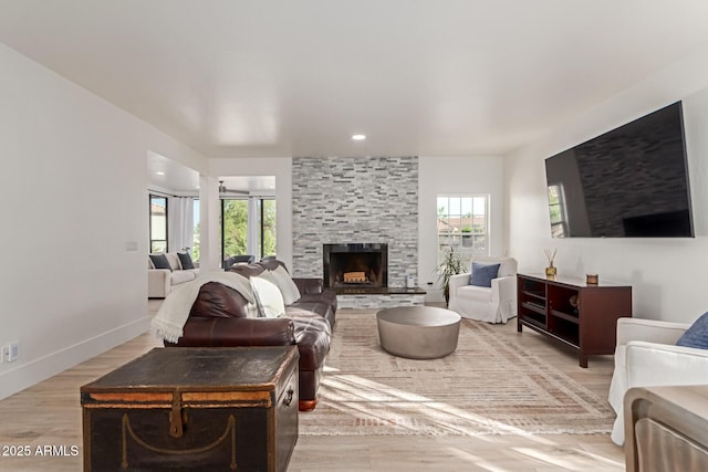12015 S Tuzigoot Dr, Phoenix, AZ 85044 - living area with light wood-style flooring, a stone fireplace, baseboards, and recessed lighting