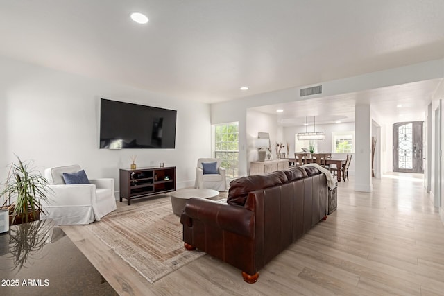 12015 S Tuzigoot Dr, Phoenix, AZ 85044 - living room with light wood finished floors, recessed lighting, and baseboards